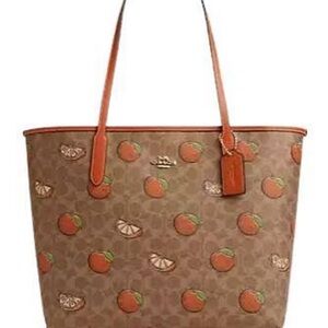 Coach signature tan with oranges city tote